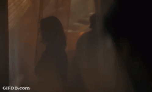 Woman Standing In Front Of Window GIF