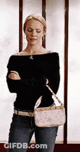 Woman Standing In Front Of Window Holding Purse GIF