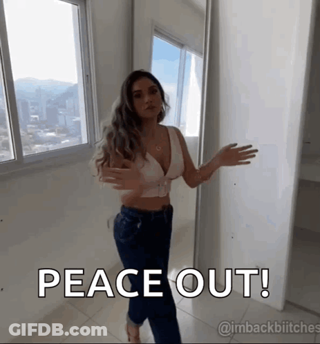 Woman Standing In Front Of Window Peace Out GIF