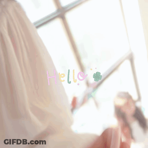 Woman Standing In Front Of Window With Hello GIF