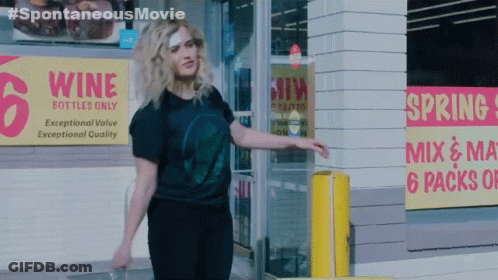 Woman Standing In Front Of Wine Store GIF
