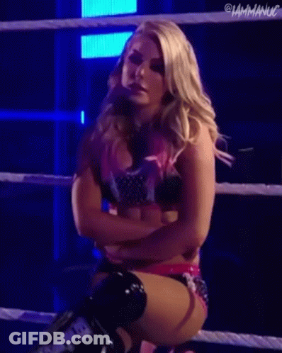 Woman Standing In Front Of Wrestlemania Backlash Sign GIF