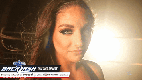 Woman Standing In Front Of WrestleMania Backlash Sign GIF