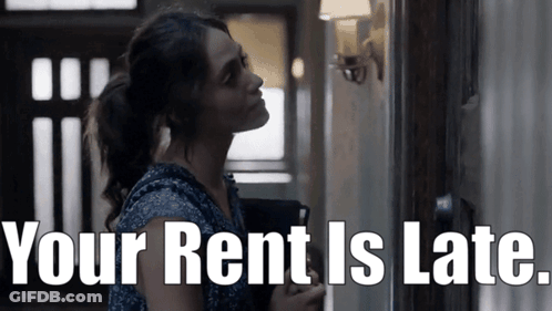 Woman Standing In Hallway With Your Rent Is Late GIF