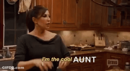 Woman Standing In Kitchen Talking GIF