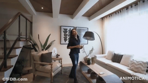Woman Standing In Living Room GIF