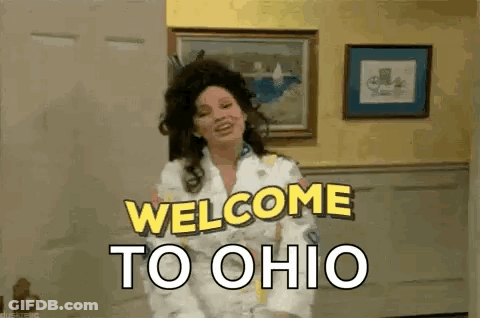 Woman Standing In Living Room Saying Welcome To Ohio GIF