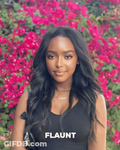 Woman Standing In Pink Flowers Flaunt GIF