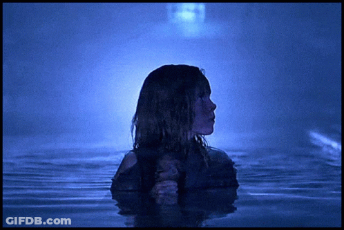 Woman Standing In Water With Ghost GIF