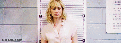 Woman Standing Next To 7 Inch Ruler GIF