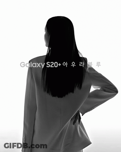 Woman Standing Next To Blue Phone With Korean Writing GIF