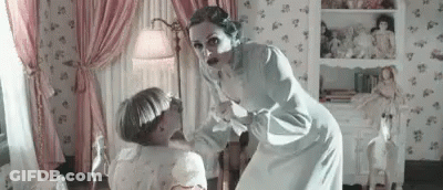 Woman Standing Next To Child In Pink Curtains GIF