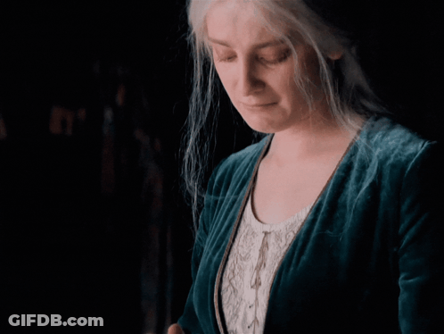 Woman Standing Next To Couch Saying Ech Leave Me Alone GIF