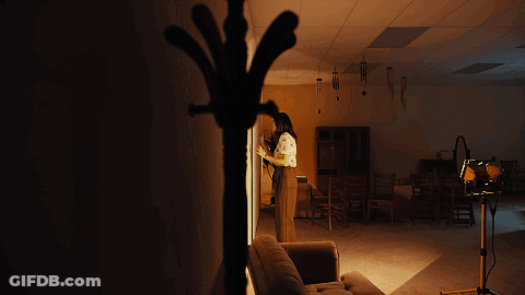 Woman Standing Next To Couch GIF