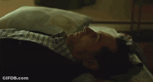 Woman Standing Next To Man Laying On Bed With True Logo GIF