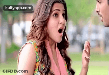 Woman Standing Next To Man With Mouth Open GIF