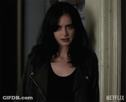 Woman Standing Next To Netflix Door GIF