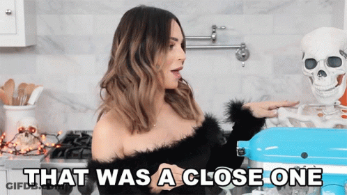 Woman Standing Next To Skeleton That Was A Close One GIF