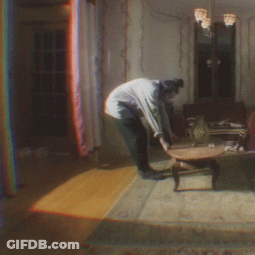 Woman Standing Next To Table GIF