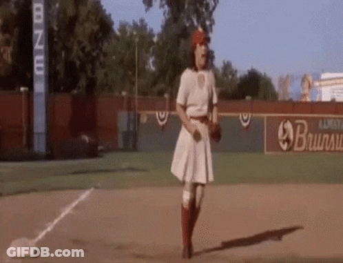 Woman Standing On Baseball Field Holding Baseball GIF