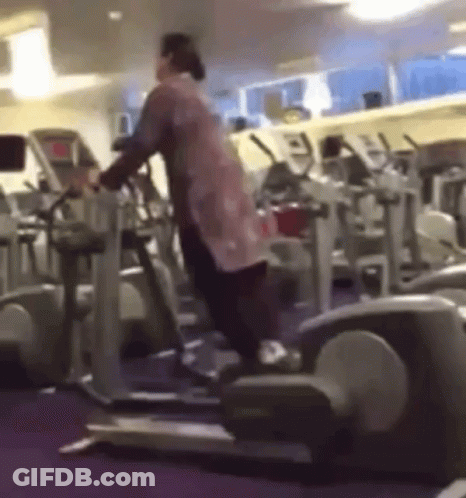 Woman Standing On Elliptical Machine GIF