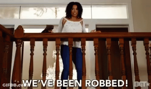 Woman Standing On Railing Saying We've Been Robbed GIF