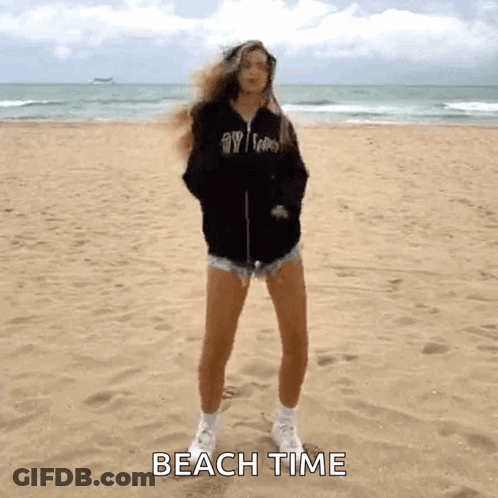 Woman Standing On Sandy Beach Saying Beach Time GIF