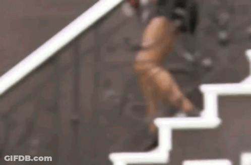 Woman Standing On Stairs GIF