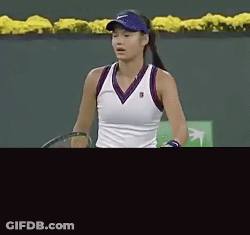 Woman Standing On Tennis Court With Racquet GIF