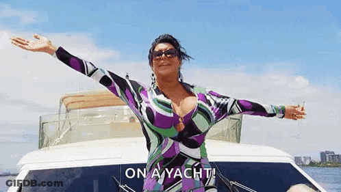 Woman Standing On Yacht With Arms Outstretched GIF
