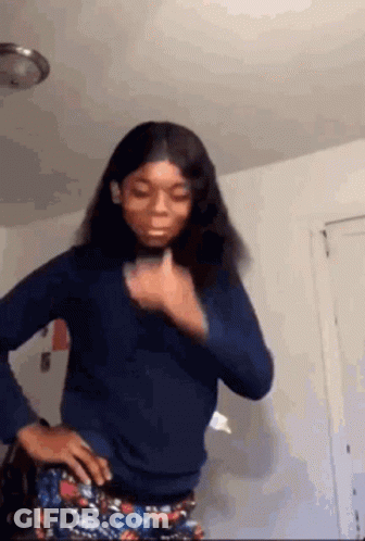 Woman Standing With Hands On Hips And Thumbs Up GIF