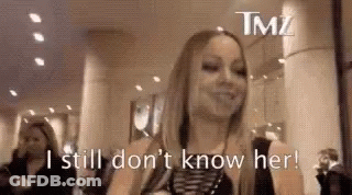 Woman Standing With Sign I Still Don't Know Her GIF