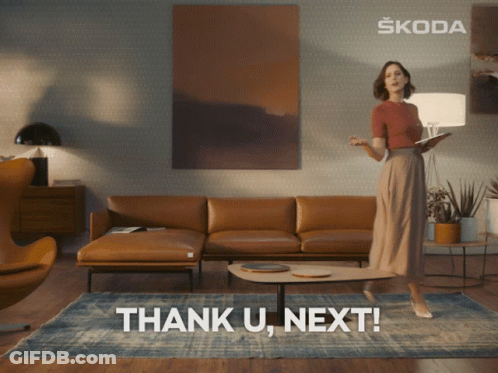 Woman Standing With Skoda Logo Behind Her GIF