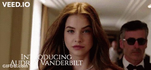 Woman Stands In Front Of Man Introducing Audrey Vanderbilt GIF