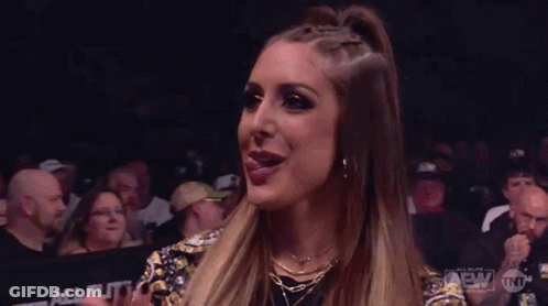 Woman Sticking Tongue Out In Front Of Crowd GIF