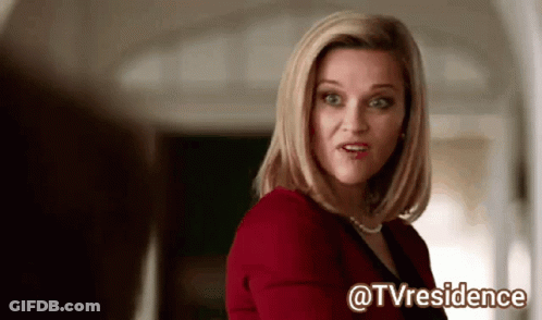 Woman Sticking Tongue Out In Kitchen GIF