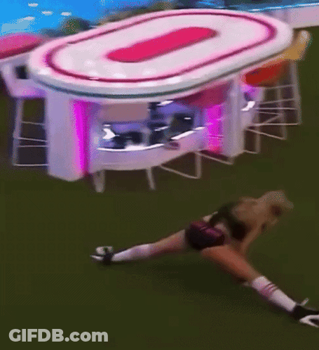 Woman Stretching On Grass Beside Table With 0 GIF
