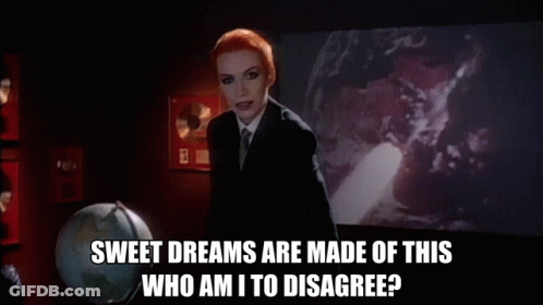 Woman Suit Tie Holding Wand Says Sweet Dreams Are Made Of This Who Am I To Disagree GIF
