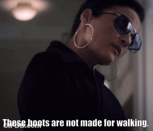 Woman Sunglasses Hoop Earrings These Boots Not Made For Walking GIF