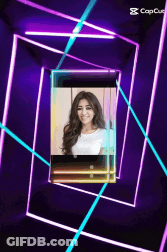 Woman Surrounded By Purple And Blue Neon Lights GIF