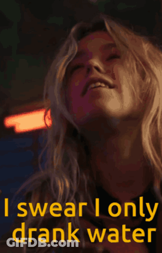 Woman Swears She Only Drank Water Holding Glass GIF