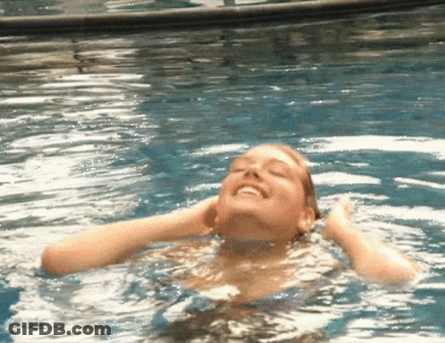 Woman Swimming In Pool Eyes Closed Smiling GIF