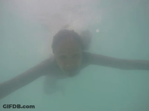 Woman Swimming Underwater Smiling GIF