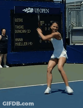 Woman Swinging Tennis Racket At Scoreboard GIF