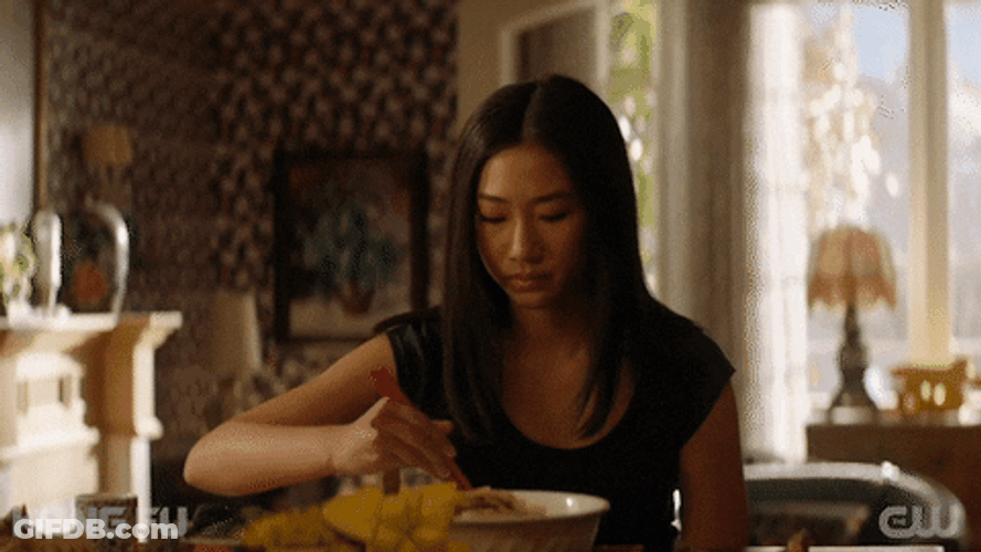 Woman Takes A Bite GIF