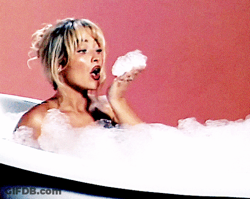 Woman Taking Bath Holding Soap GIF