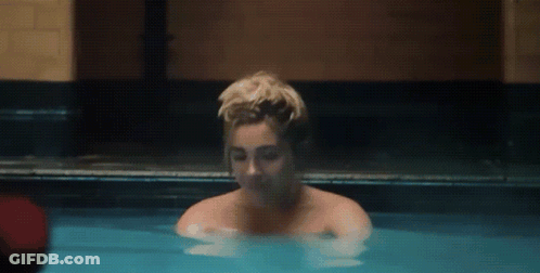 Woman Taking Bath In Blue Pool GIF