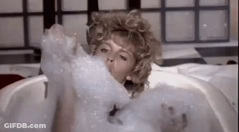 Woman Taking Bath In Soap Bubbles GIF