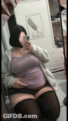 Woman Taking Mirror Selfie GIF