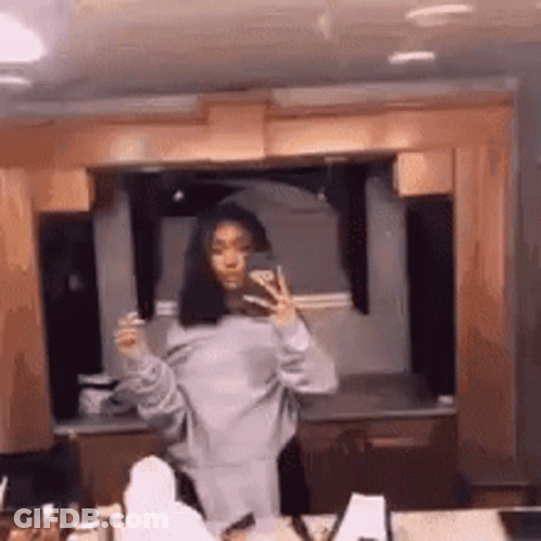 Woman Taking Mirror Selfie In Kitchen GIF